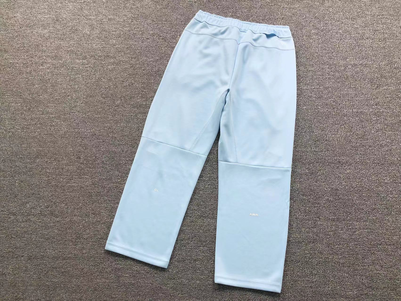 Conjunto Nocta x Nike Tech Fleece “University Blue”