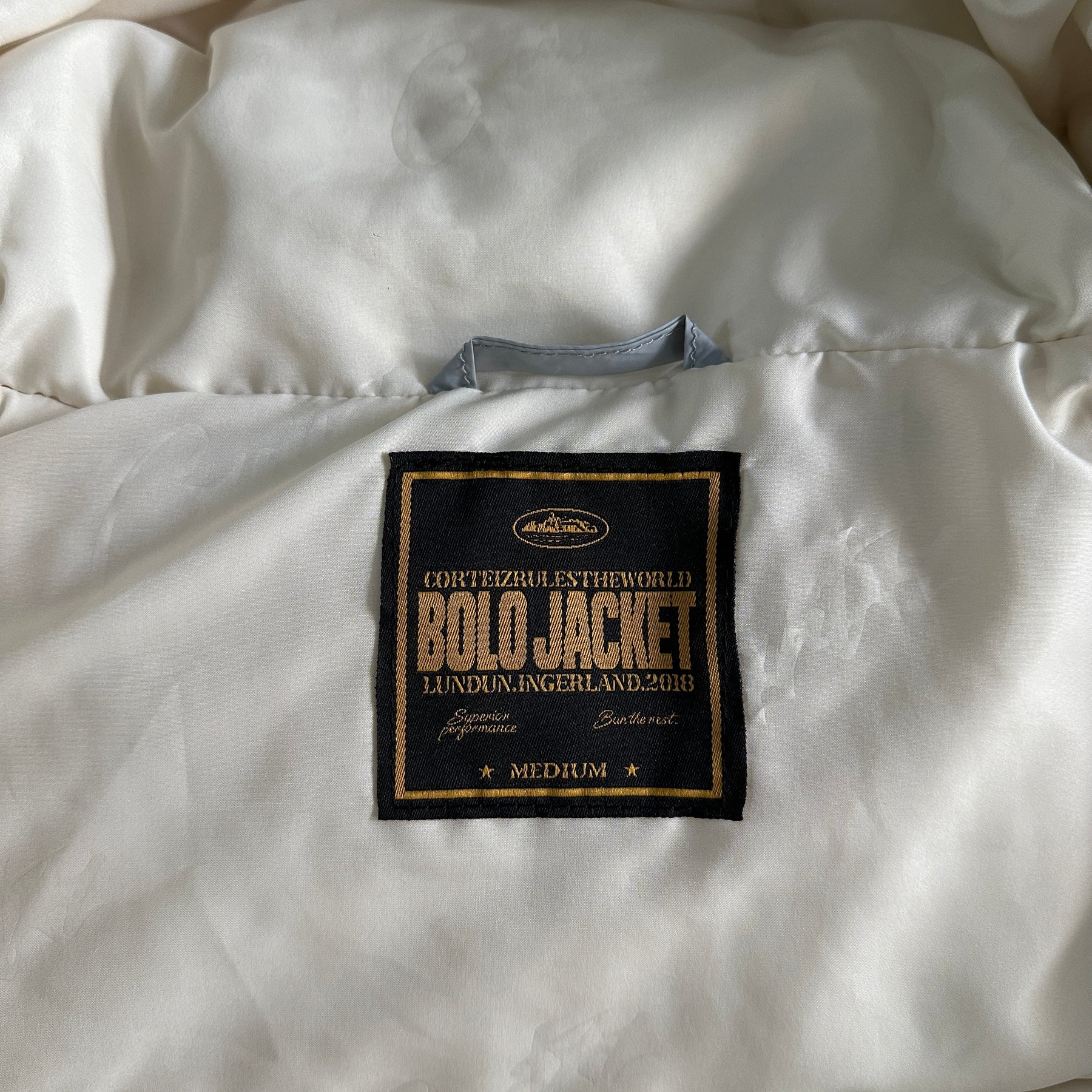 Casaco Corteiz “Bolo V2 Down” ( Cinza )