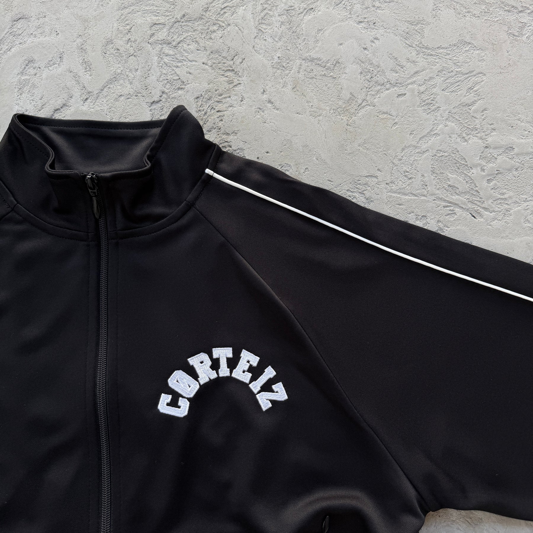 Conjunto Corteiz “Crest Arch Track Set”