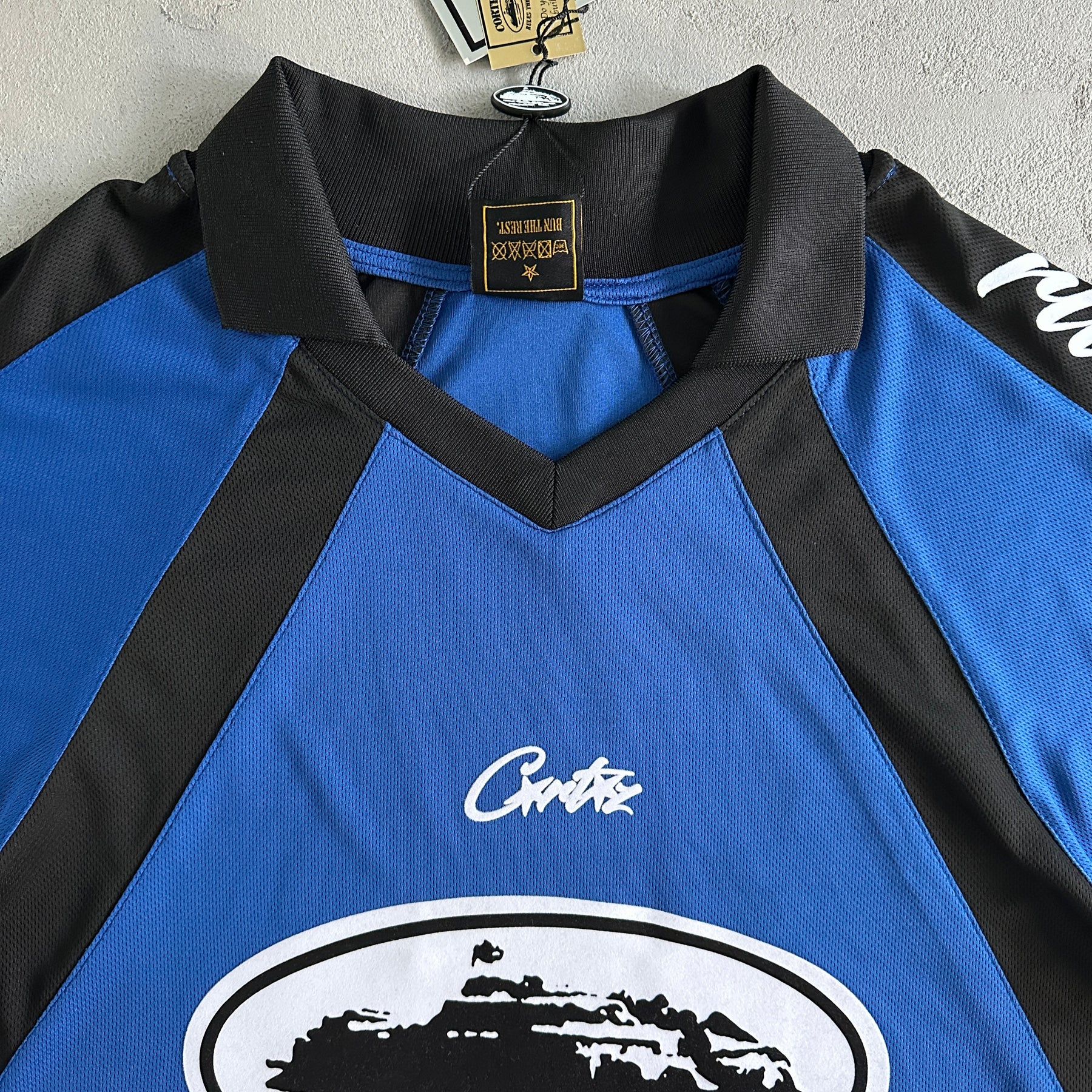 Camisa Corteiz ”Panel” ( Preta Com azul )