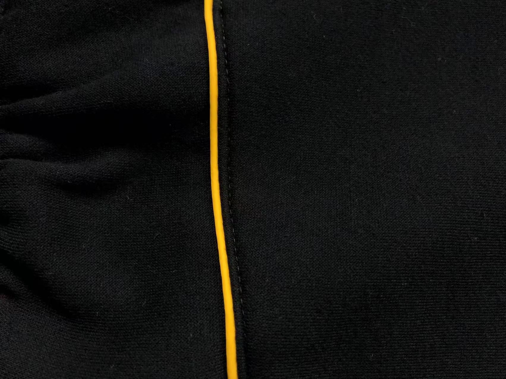 Conjunto Nocta x Nike “University Gold”