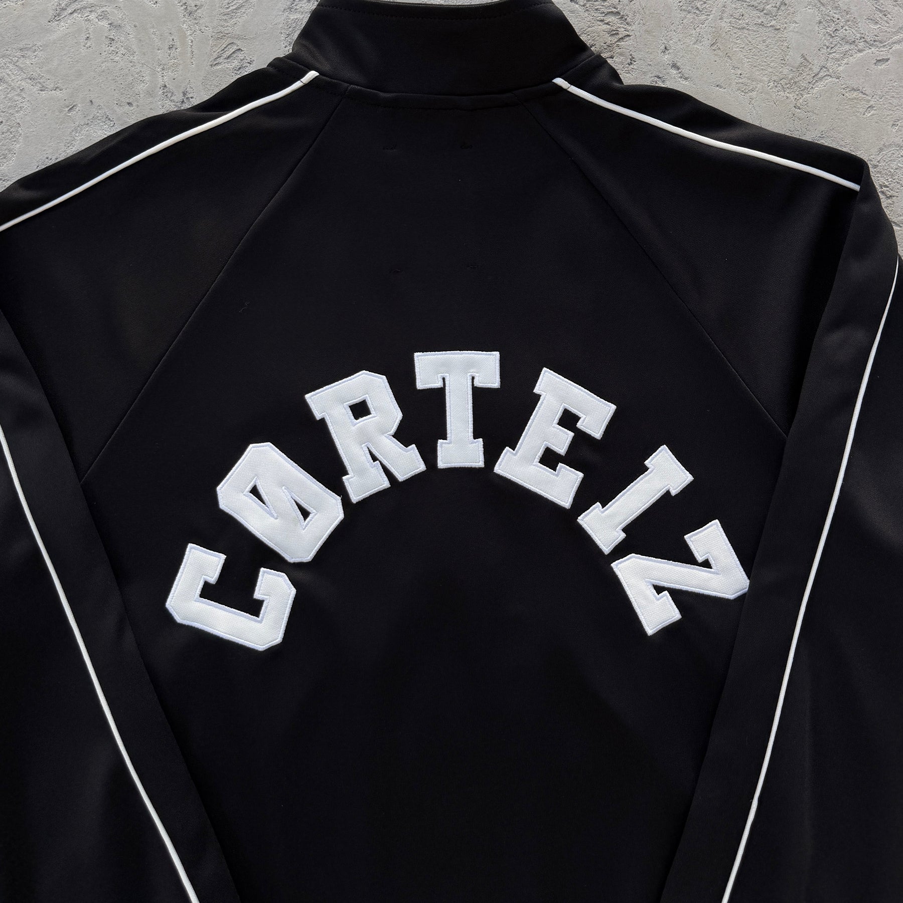 Conjunto Corteiz “Crest Arch Track Set”