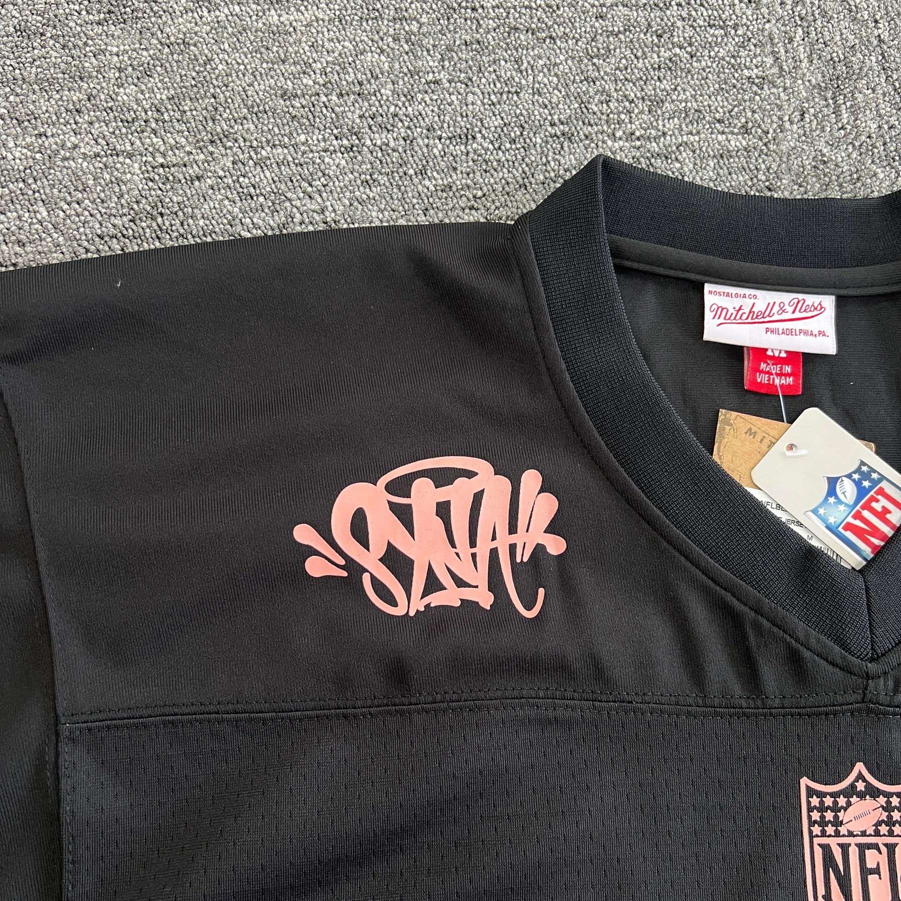 Camisa Syna World X Mitchell & Ness NFL CRG