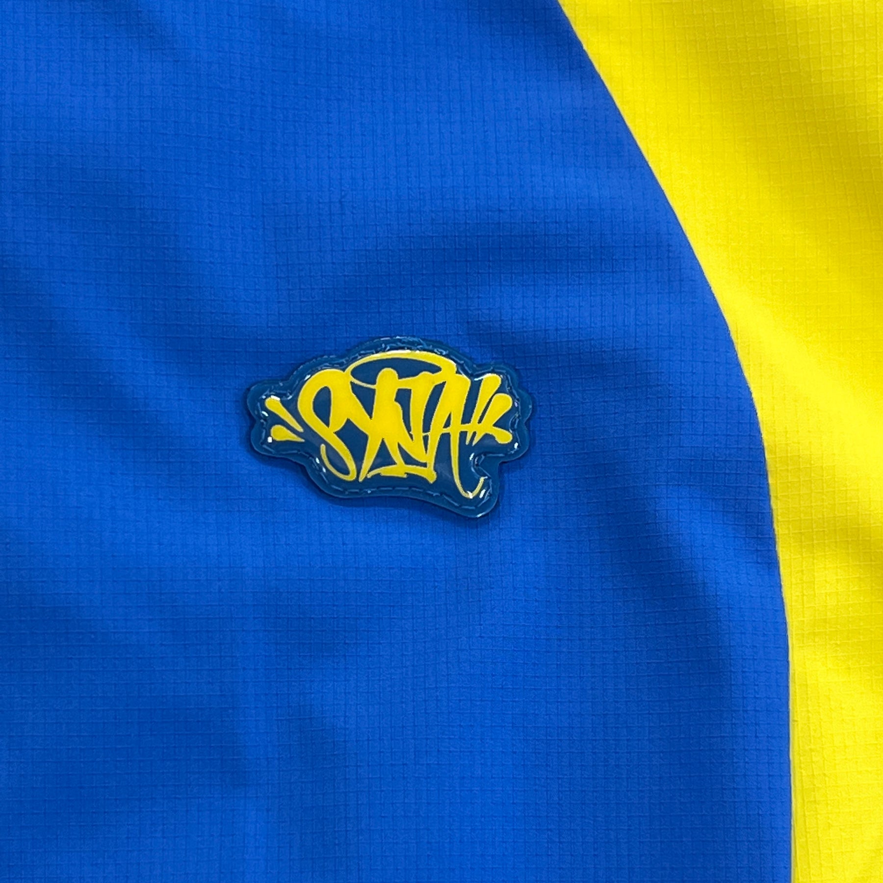 Conjunto Syna World “Vortex Track” ( Azul e Amarelo )
