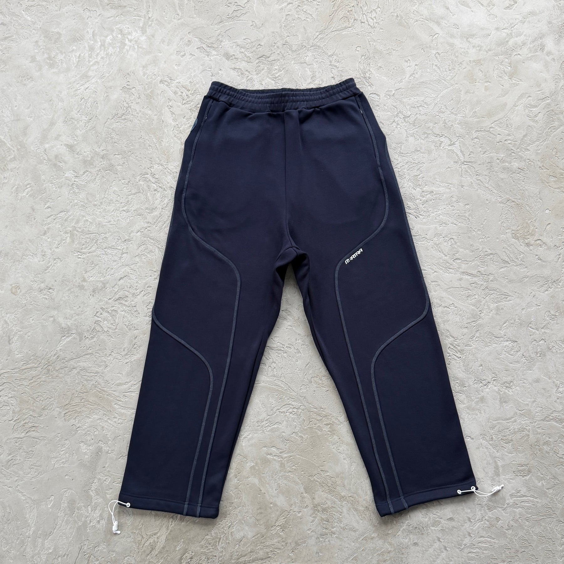 Conjunto Mertra “Glide Overlock Trackie”