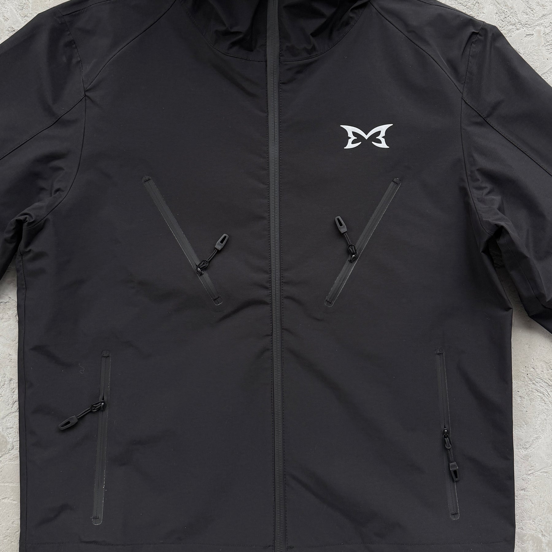 Corta Vento Mertra “Monogram Shell V2” ( Pova D'água )