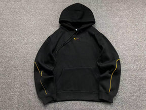 Conjunto Nocta x Nike “University Gold”