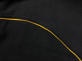 Conjunto Nocta x Nike “University Gold”