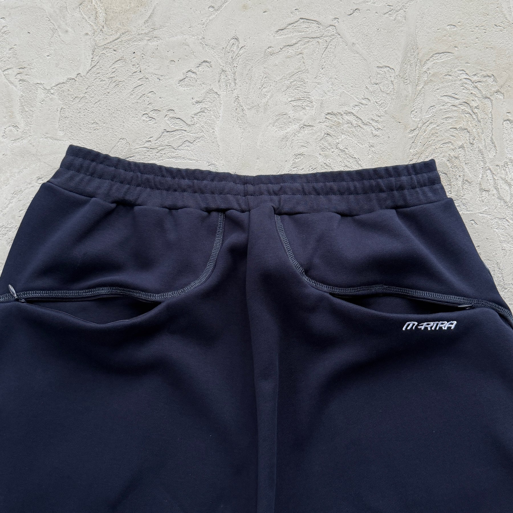 Conjunto Mertra “Glide Overlock Trackie”