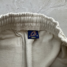 Conjunto Corteiz “Woosh Open Hem Sweatp”