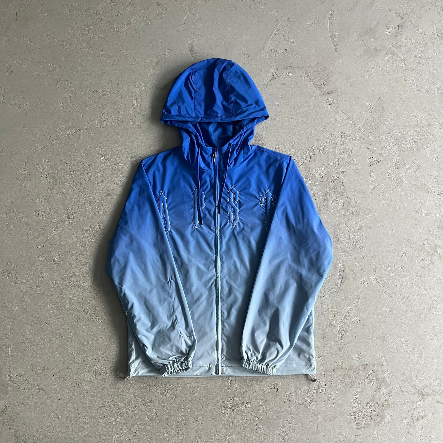 Corta Vento Trapstar “Outline Arch” ( Sky Blue )