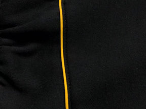 Conjunto Nocta x Nike “University Gold”