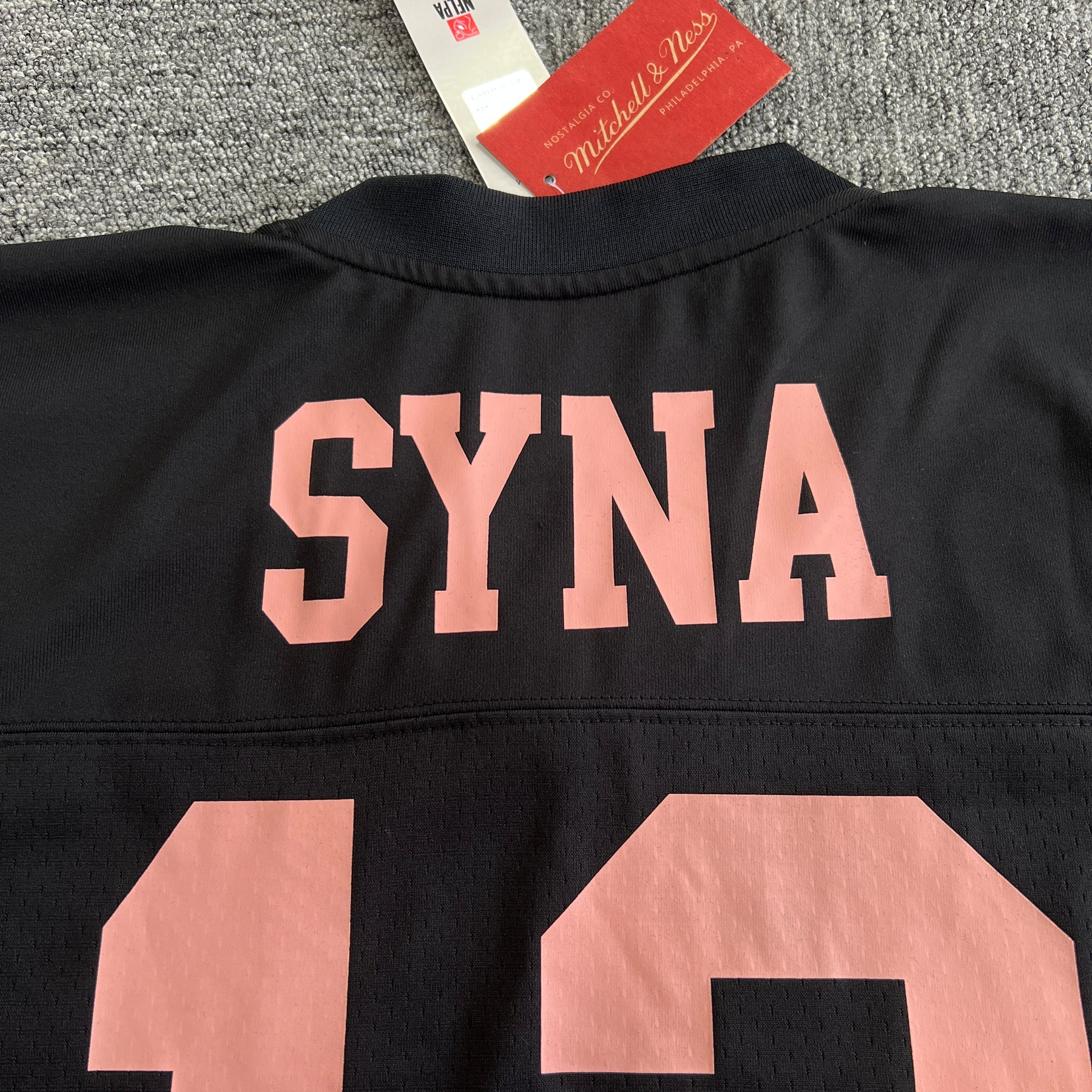 Camisa Syna World X Mitchell & Ness NFL CRG