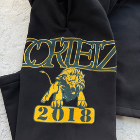 Conjunto Corteiz “Lion Varsity Open Hem Zip”