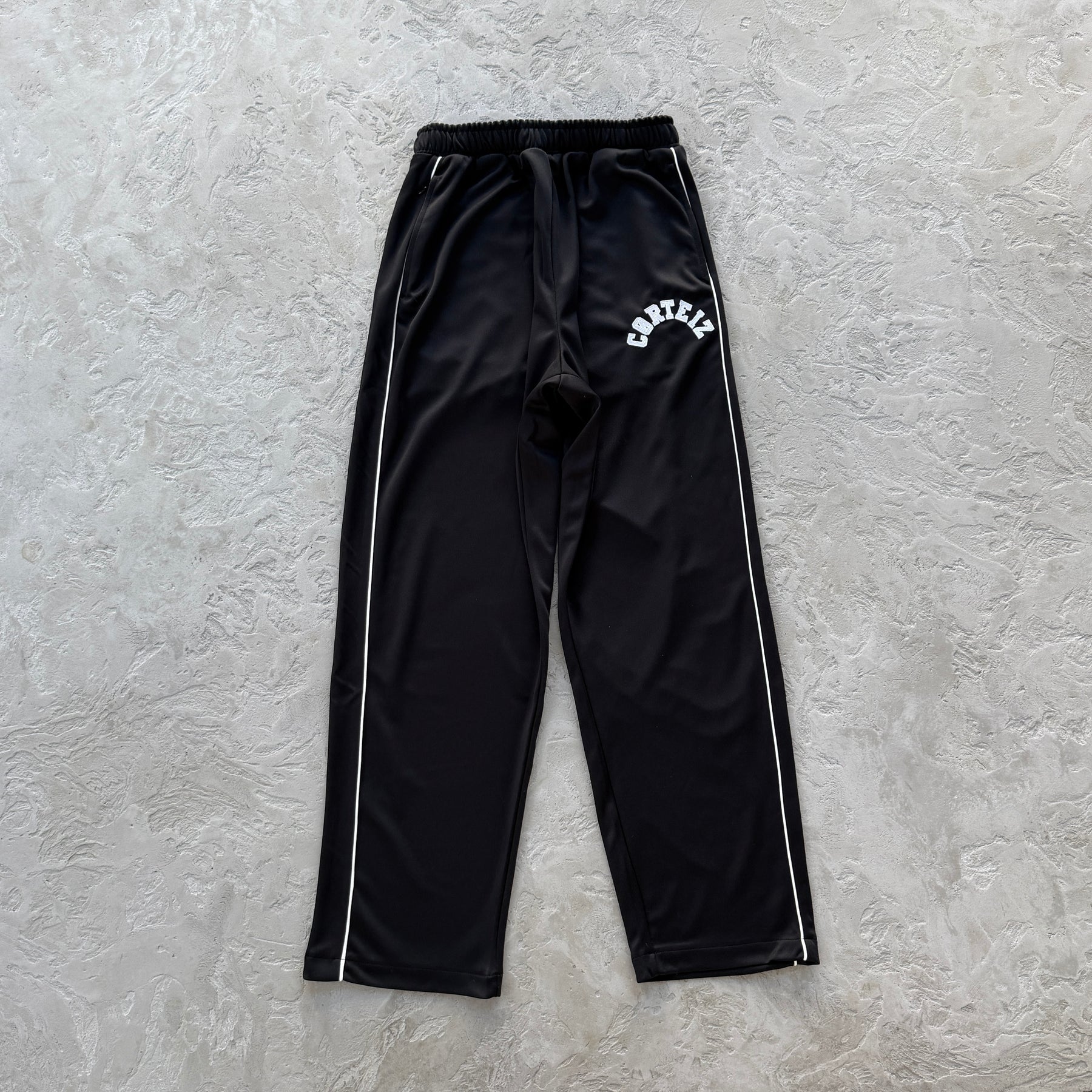 Conjunto Corteiz “Crest Arch Track Set”