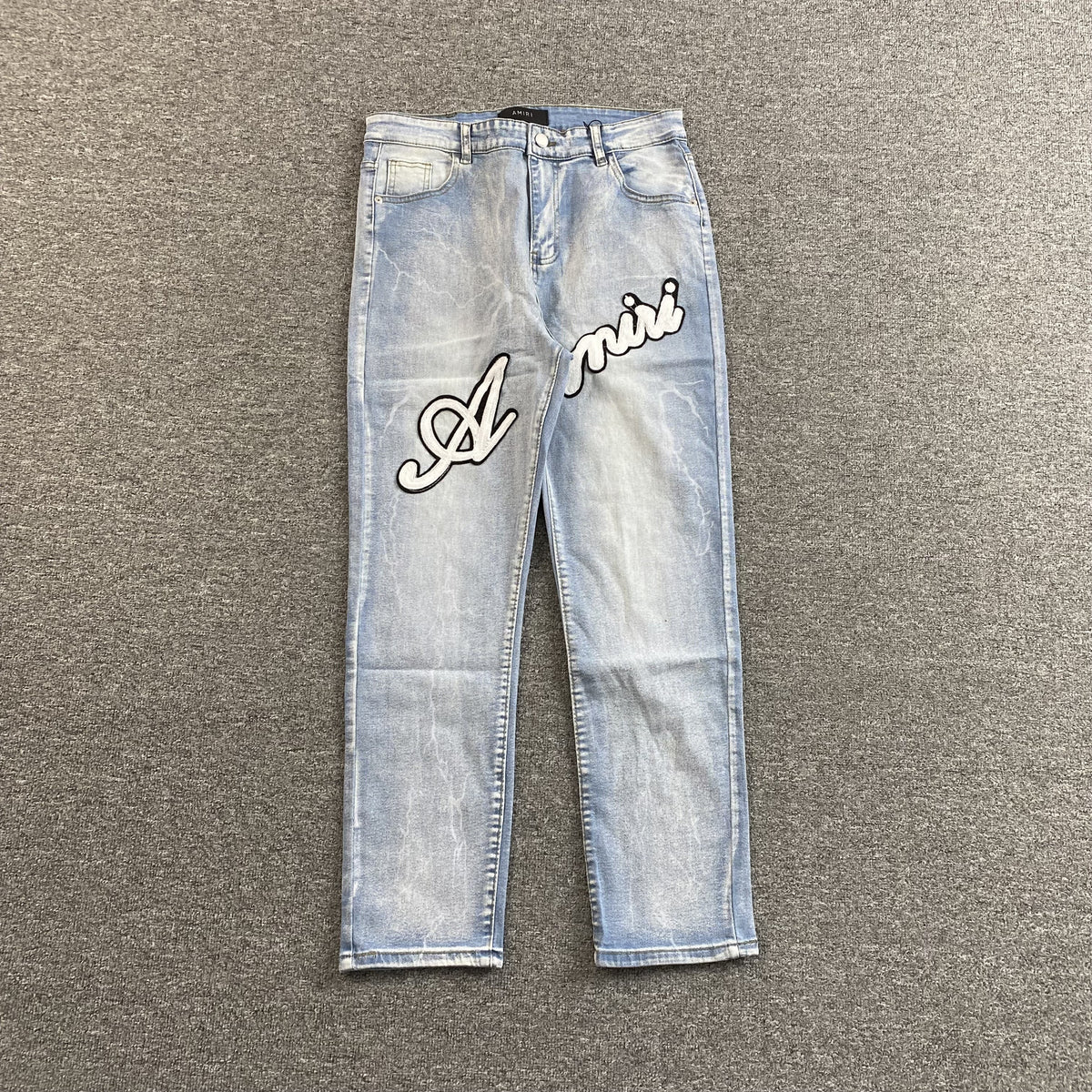 Calça Amiri “Script Logo”