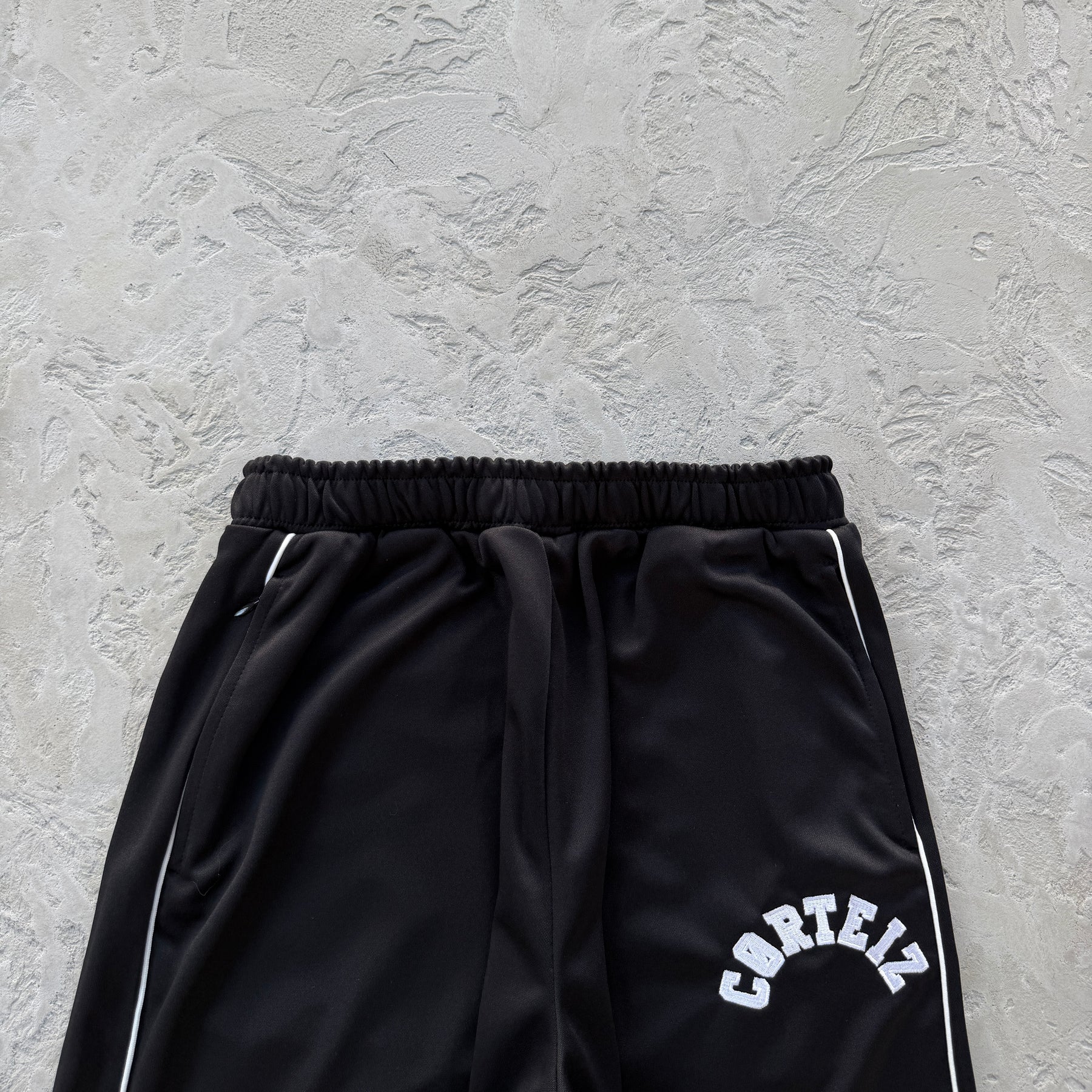 Conjunto Corteiz “Crest Arch Track Set”