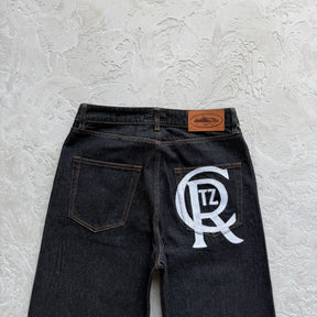 Calça Corteiz “Crest Chainstitch Baggy Jeans”