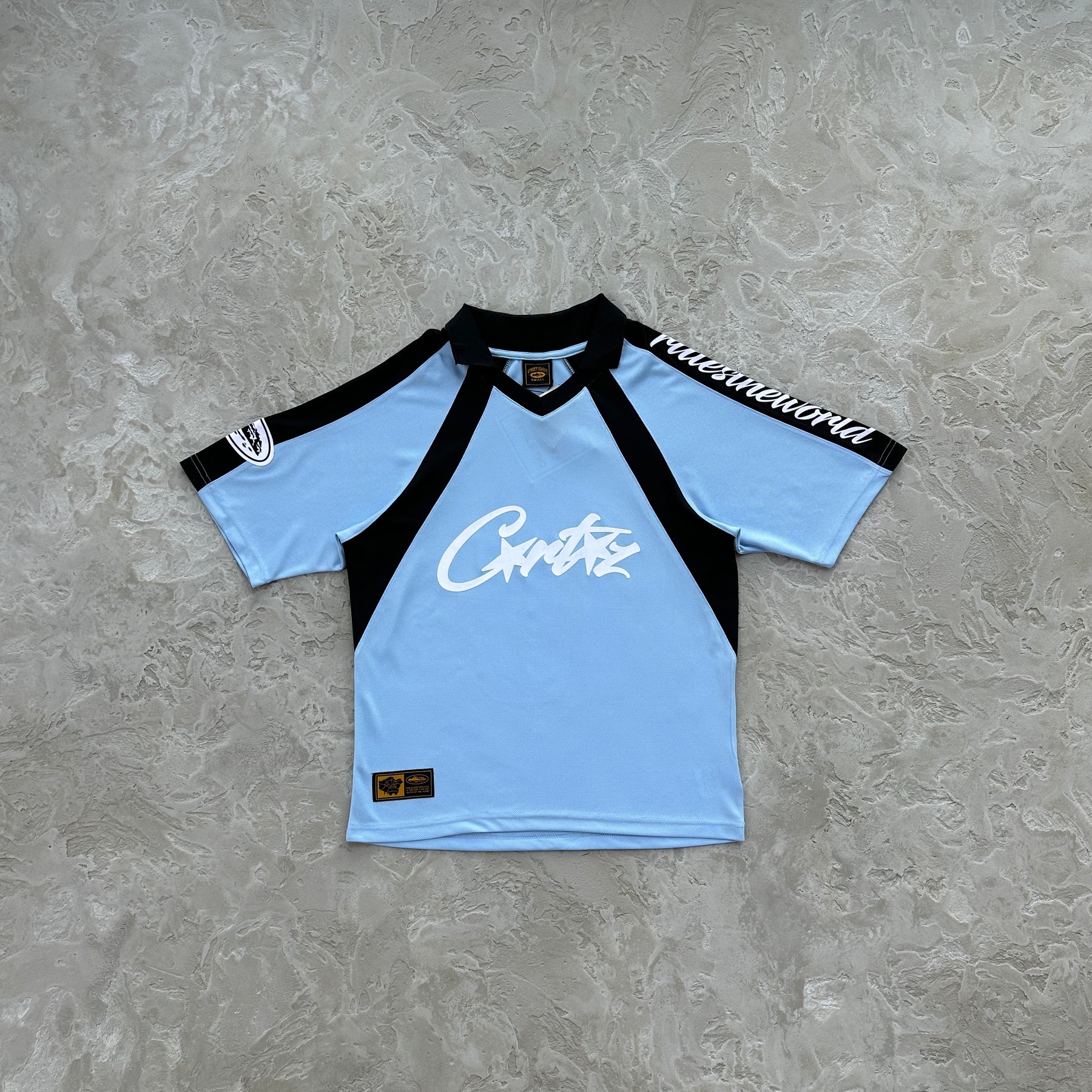 Camisa Corteiz “Panel Sky Blue Jersey”