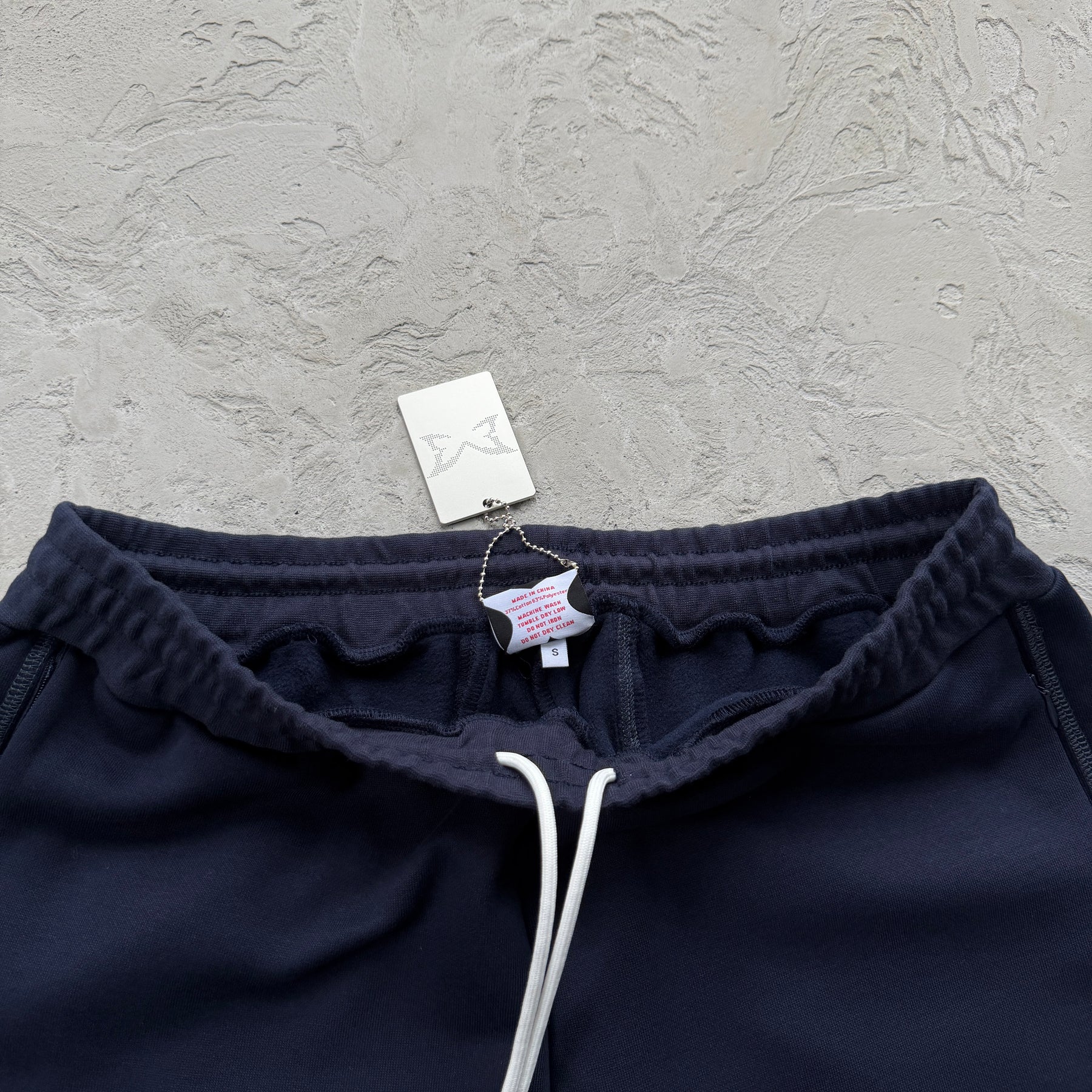 Conjunto Mertra “Glide Overlock Trackie”