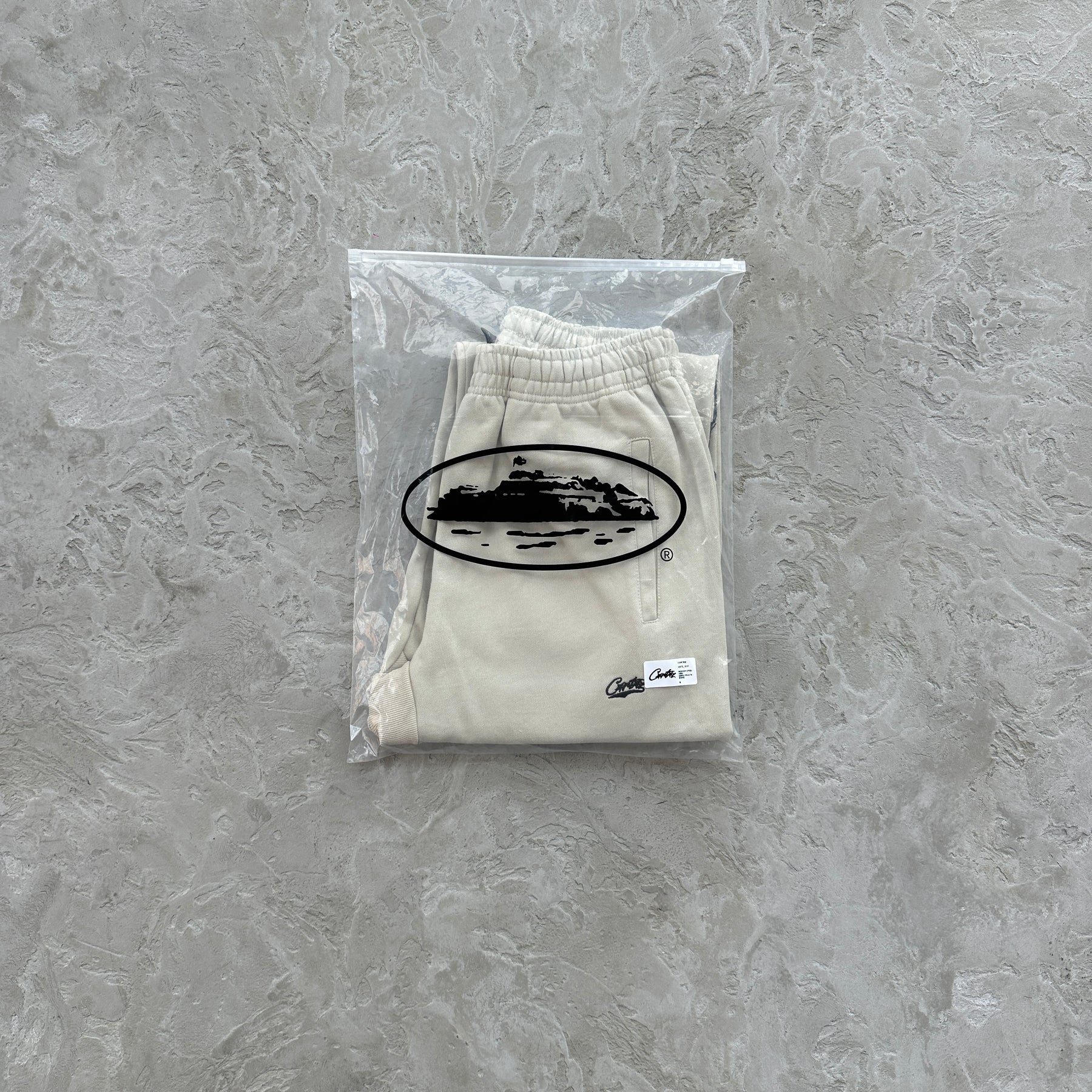 Conjunto Corteiz “Woosh Open Hem Sweatp”