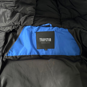 Jaqueta Trapstar “Decoded Arch Puffer”