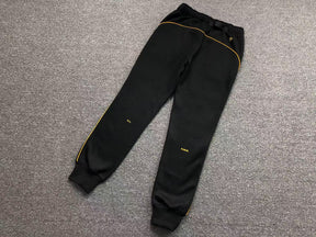 Conjunto Nocta x Nike “University Gold”