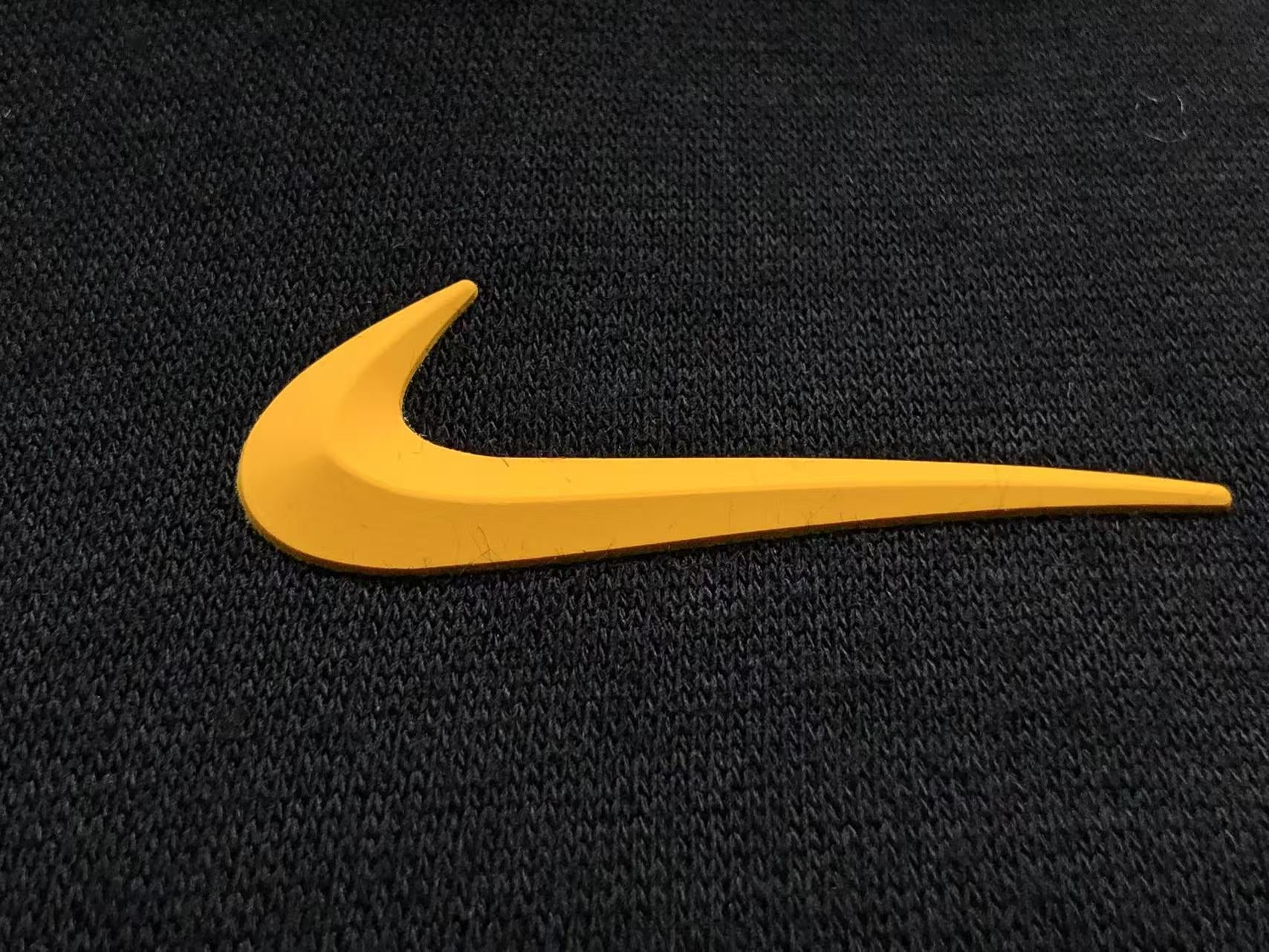 Conjunto Nocta x Nike “University Gold”