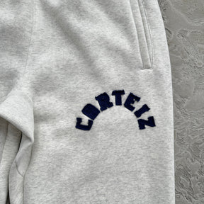 Conjunto Corteiz “College Arch Open”