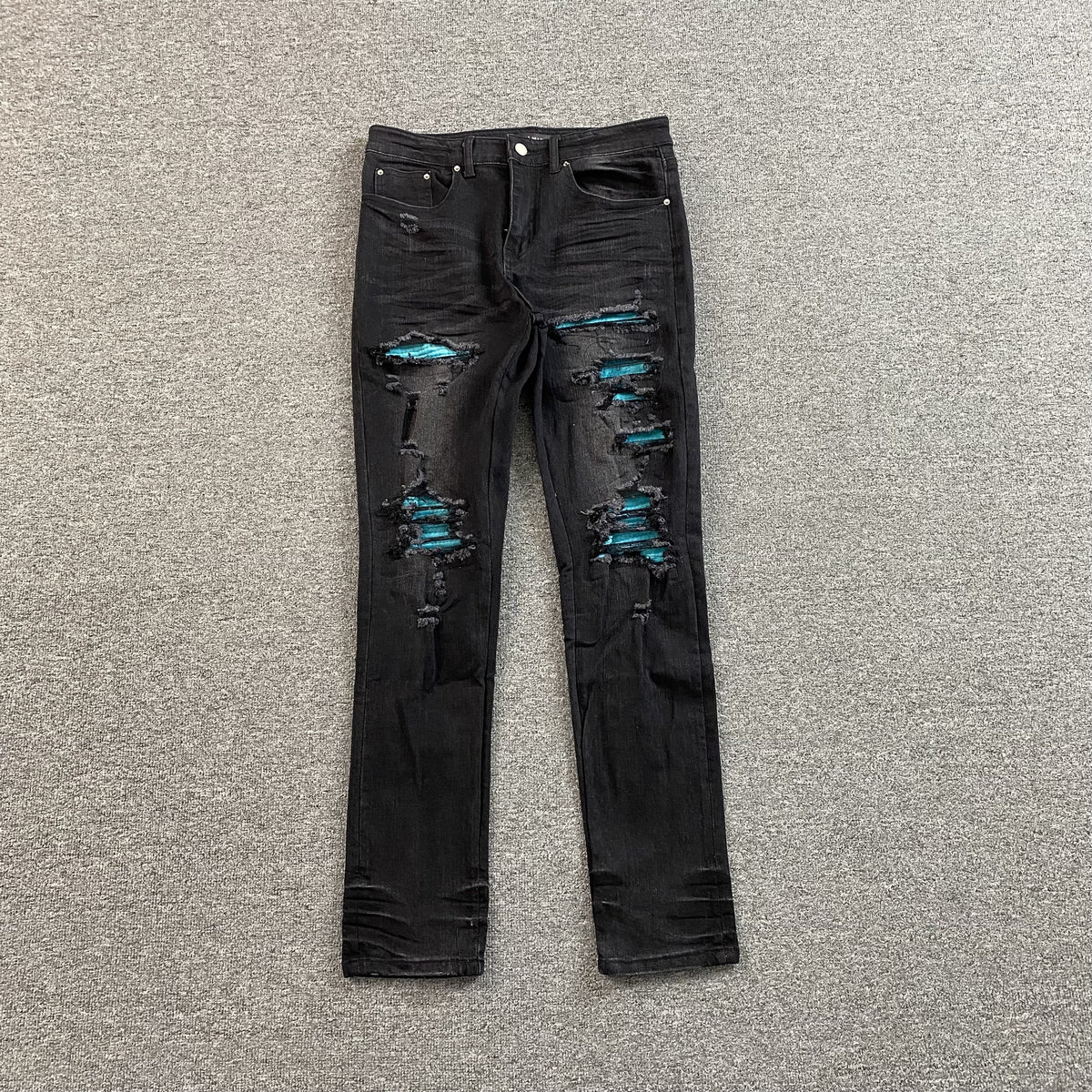 Calça Amiri “MX1 Cracked Paint”