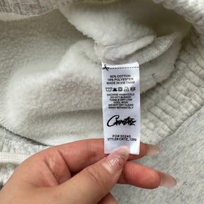 Conjunto Corteiz “College Arch Open”