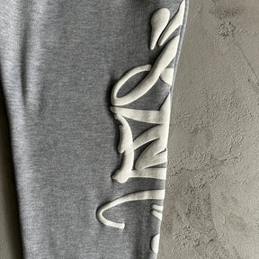 Conjunto Syna World “Safety Grey“