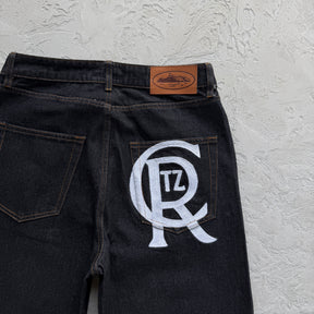 Calça Corteiz “Crest Chainstitch Baggy Jeans”